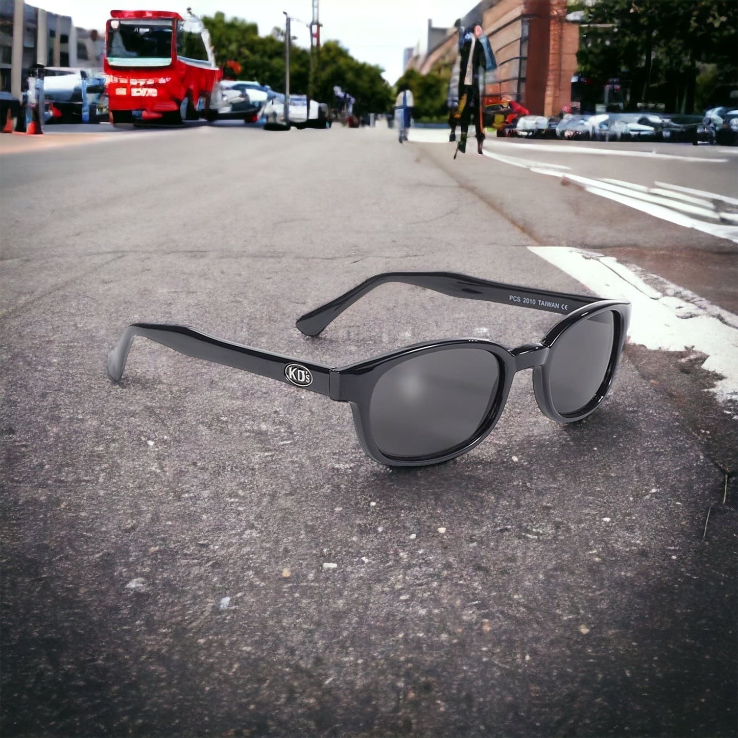 The 2010 KD's sunglasses worn by SAMCRO in Sons of Anarchy with smoked lenses placed on the road in the street.